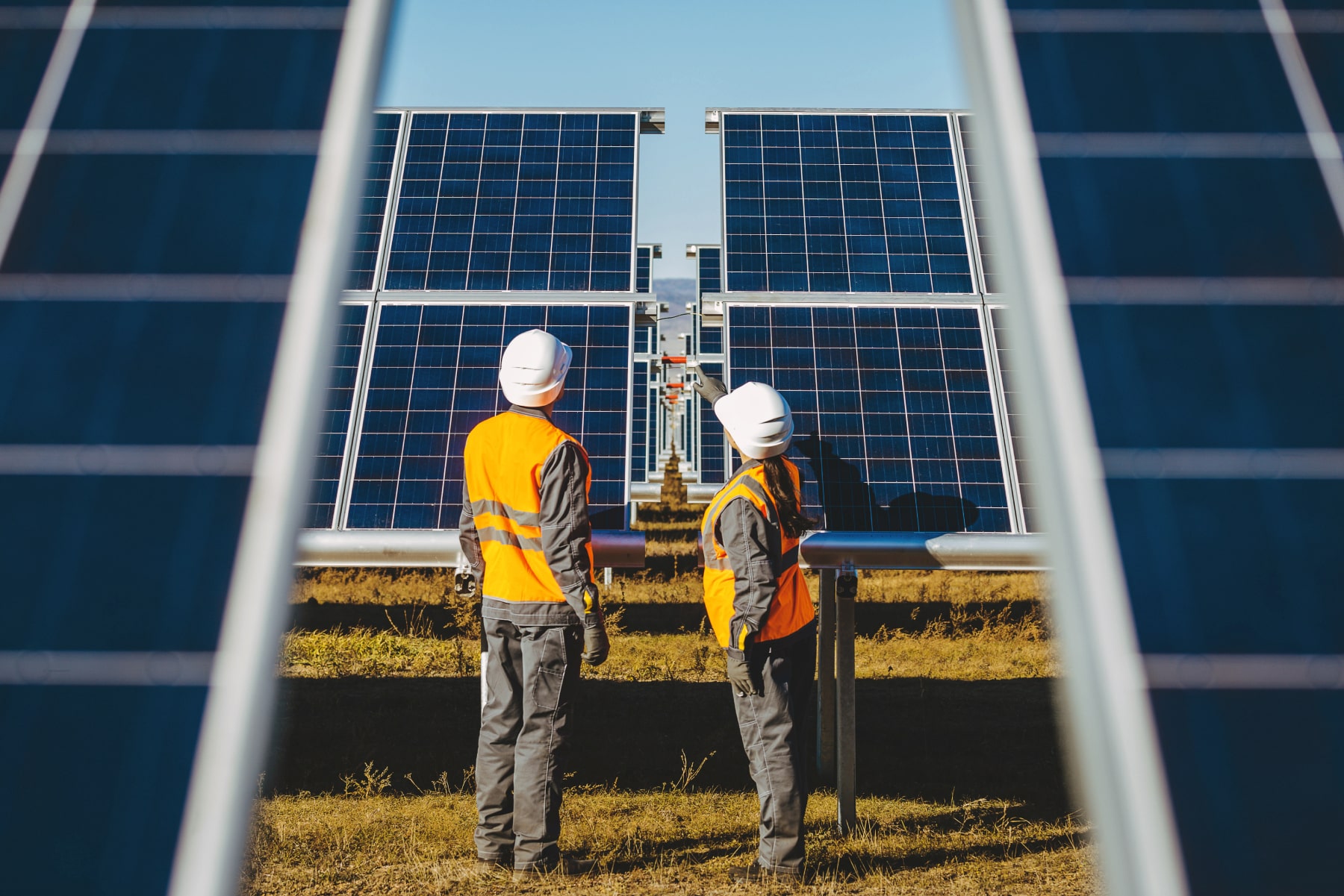 An image of workmen on a solar farm